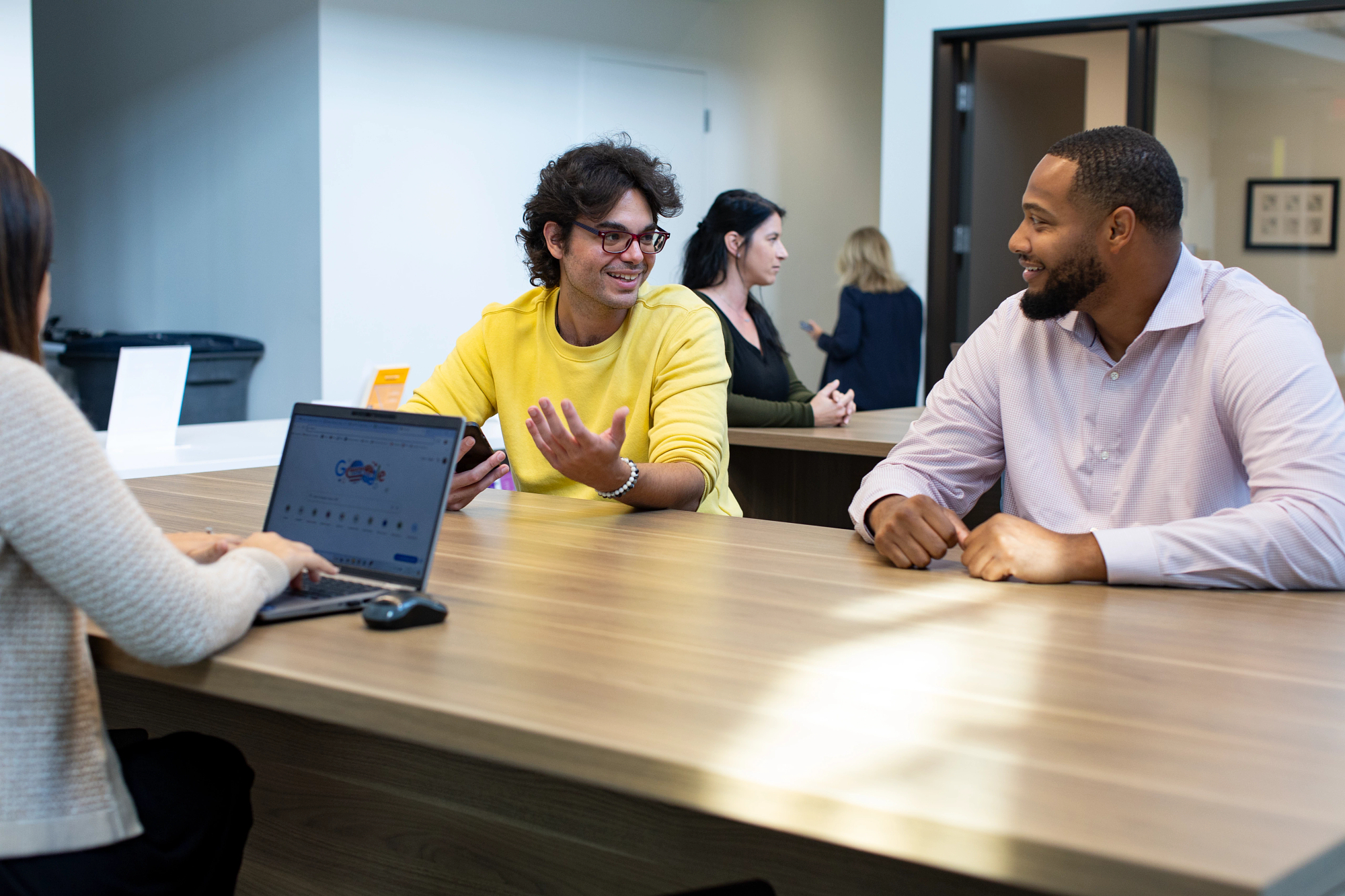 Brown University employees discussing education benefits