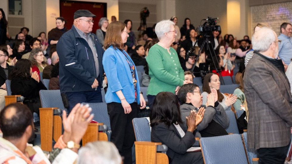 Employees standing for years of service recognition