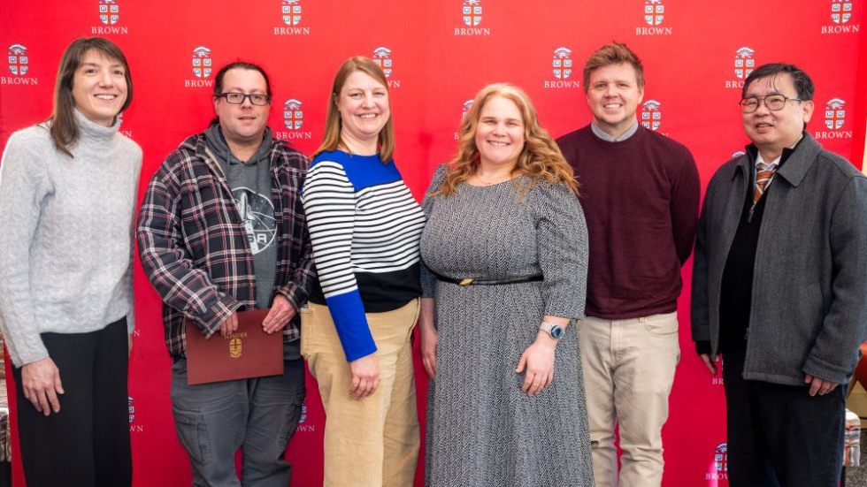 Team Excellence Award winner posing with award