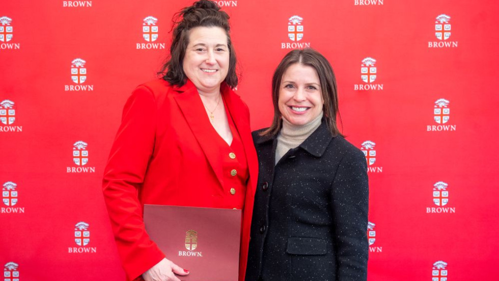 Excellence Award winner posing with award