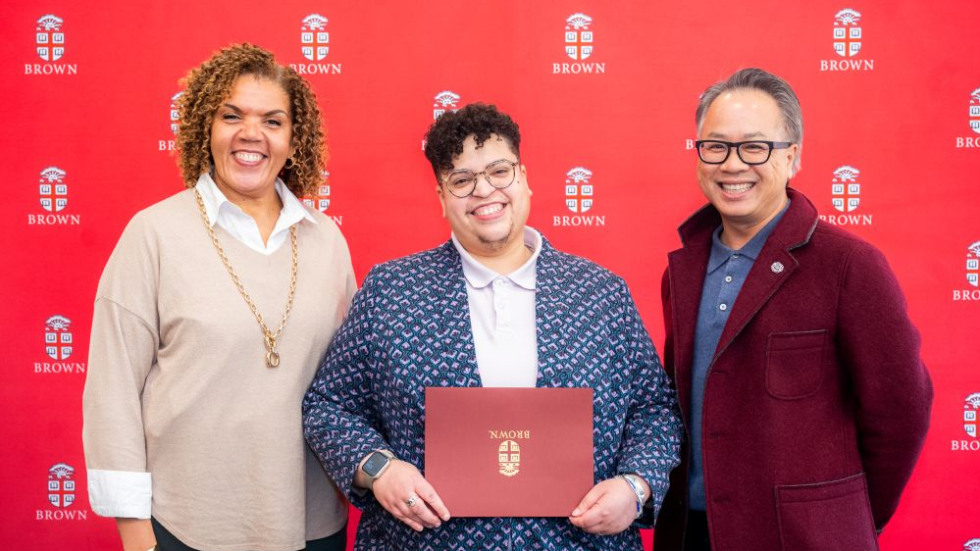 Excellence Award winner posing with award