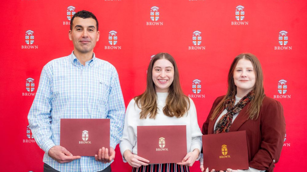 Team Excellence Award winners posing with awards